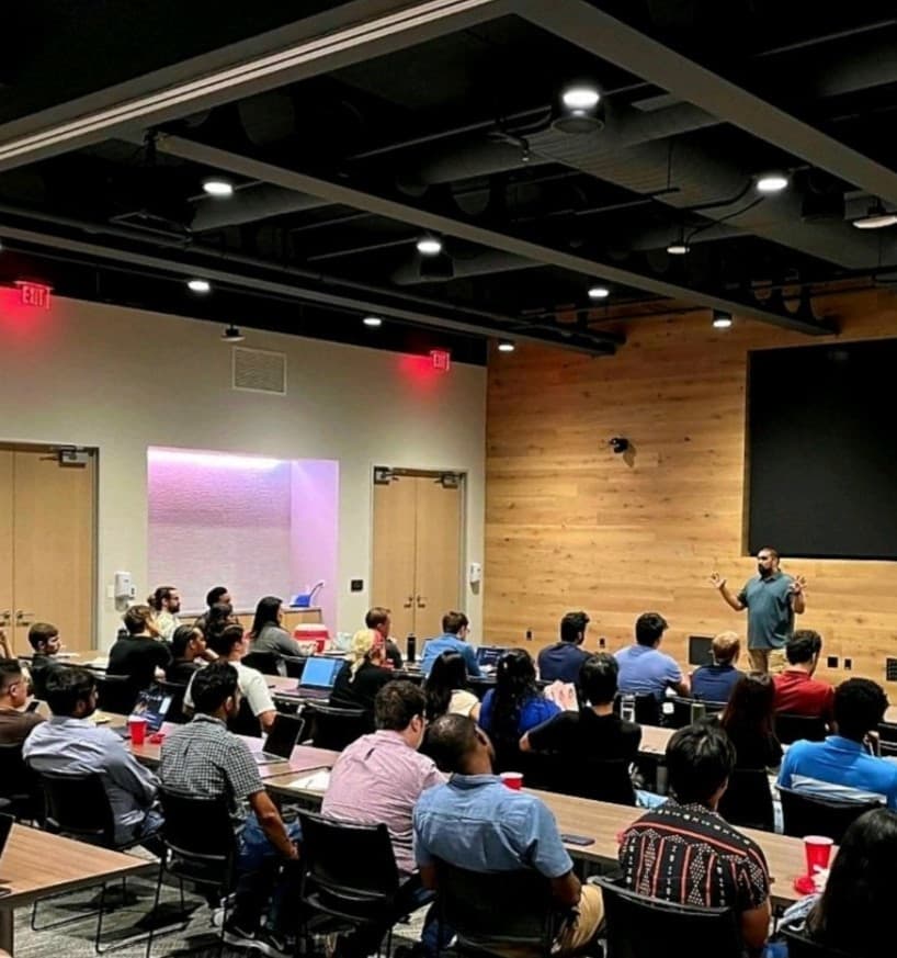 Community members discussing code at a workshop