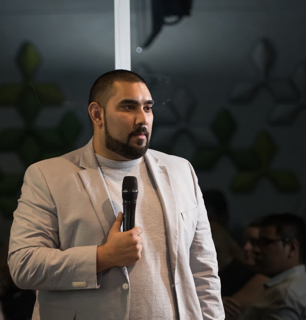 Attendees smiling at a social gathering